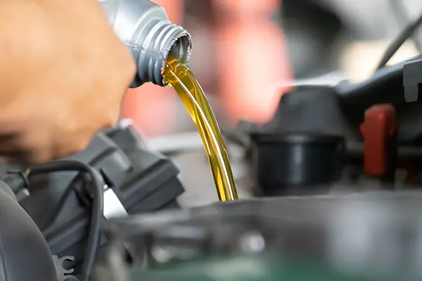 Pouring engine oil